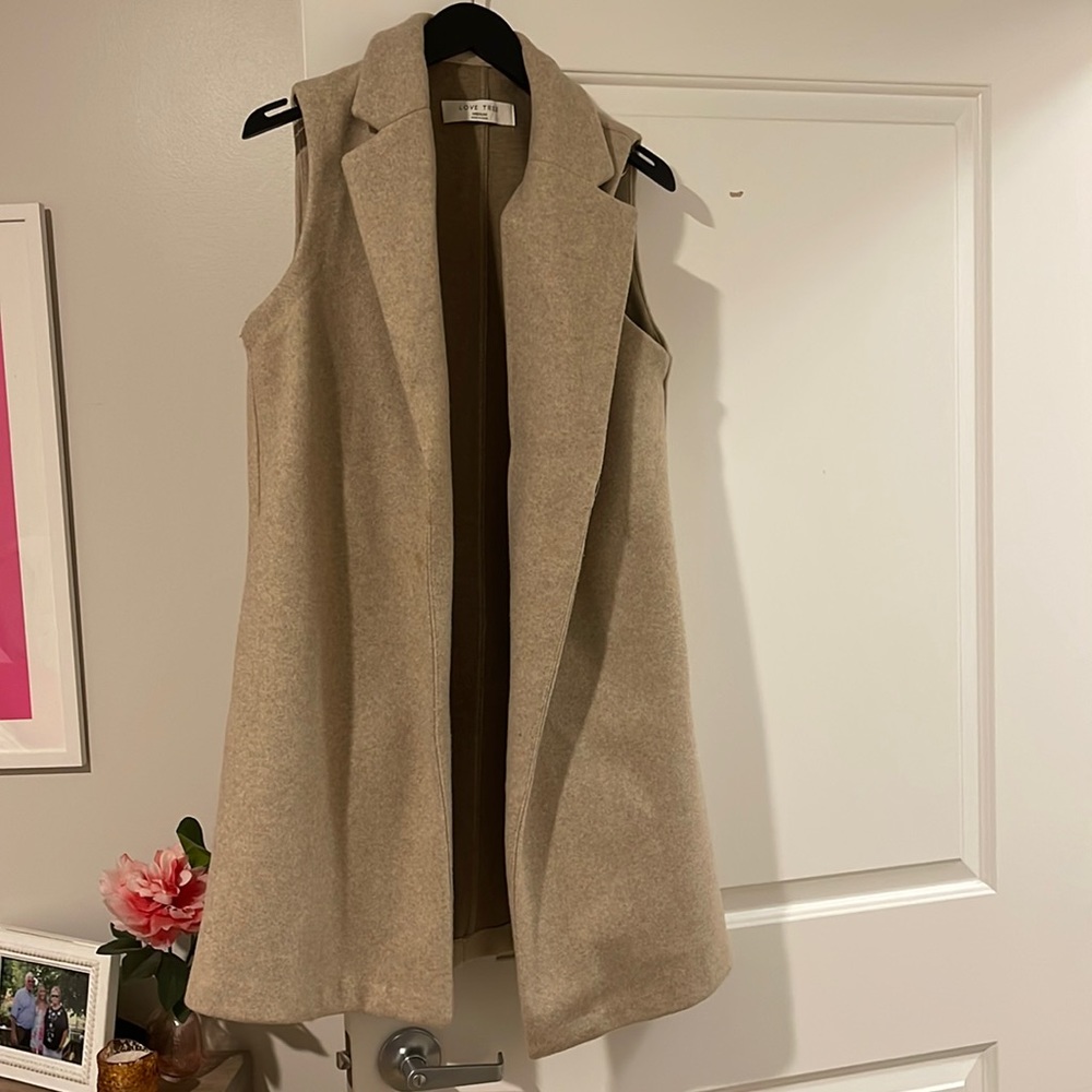 Tan sleeveless vest size small